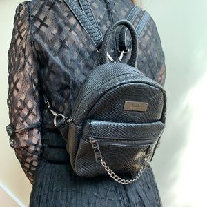 Cute BCBG leather backpack style bag. New!